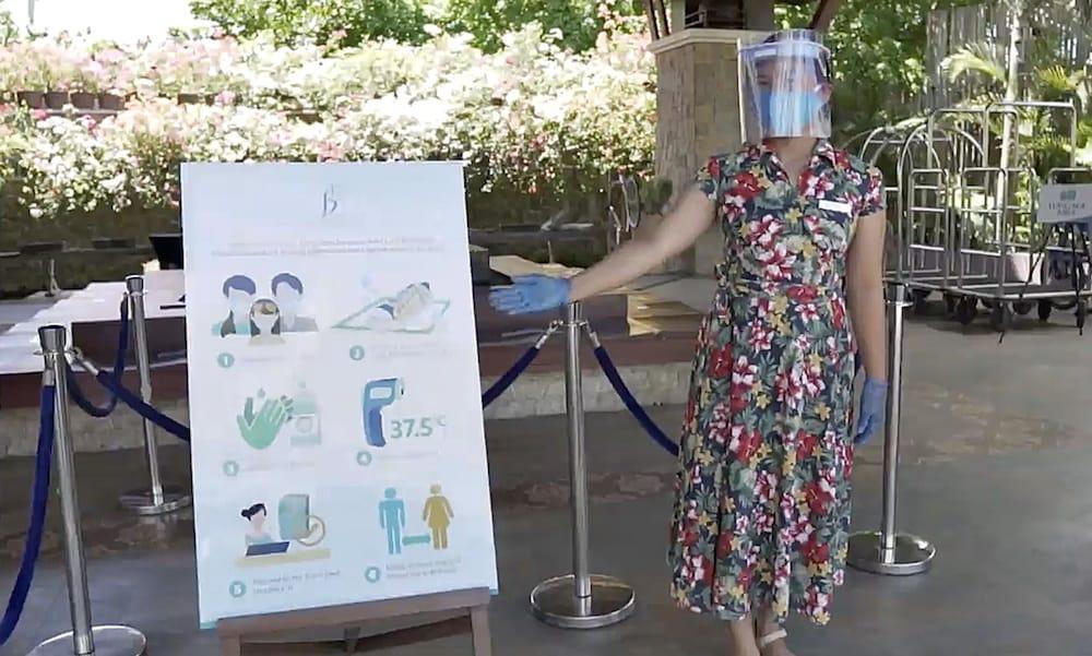 The Bellevue Resort Панглао Екстериор снимка A woman wearing a face shield at the entrance of a hotel in Paris, France